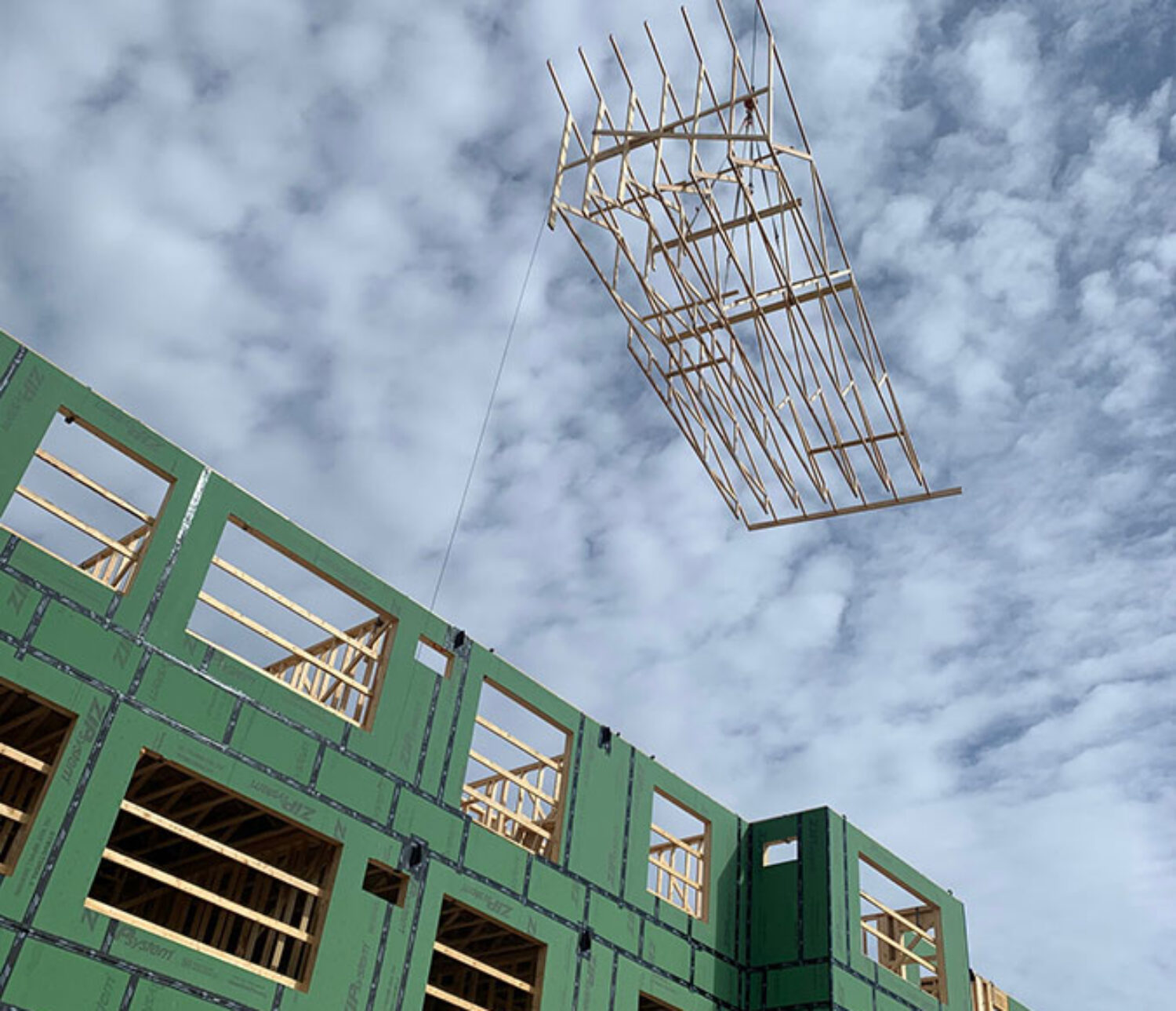 MCF Crane Service setting roof trusses